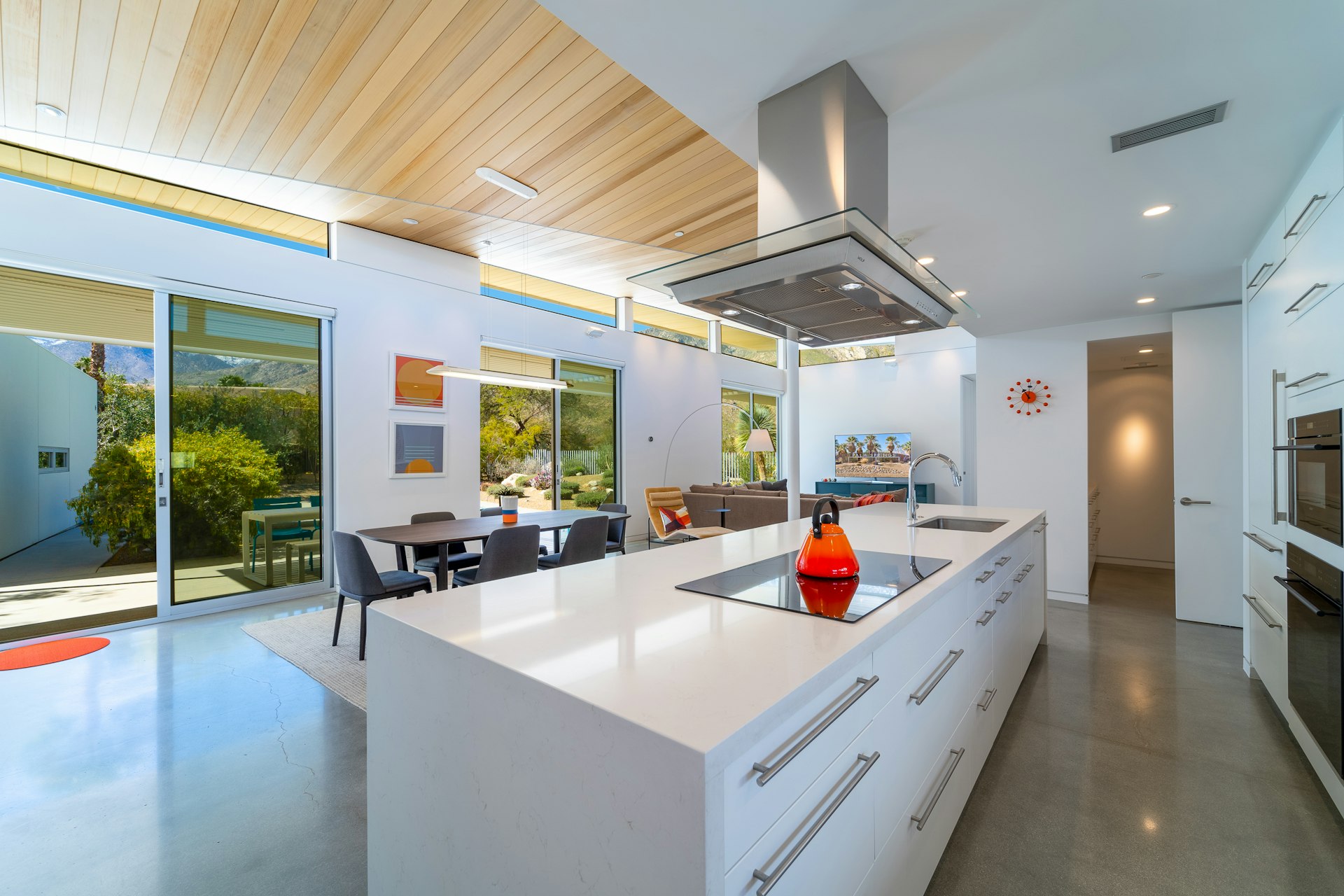 a kitchen with a large island and a stove top oven